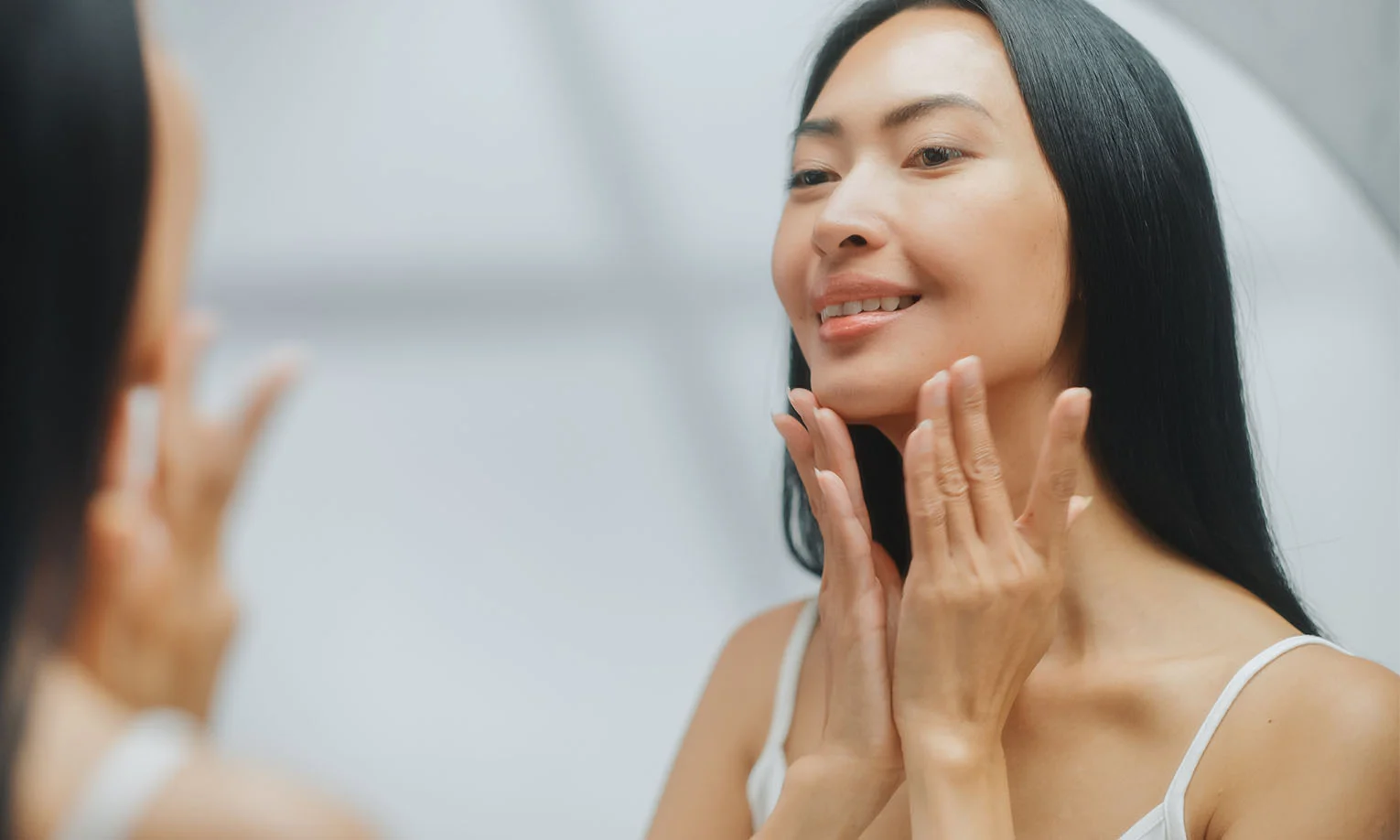 Smiling person after Celluma LED light therapy, showing glowing and rejuvenated skin post-treatment - Celluma led light therapy in West Hollywood, CA
